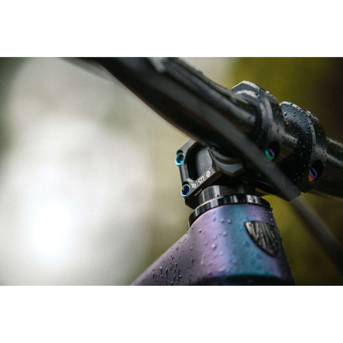 ST1 35mm Clamp - Title MTB Oil Slick Rainbow Bolts Mounted On Bike Casey Brown